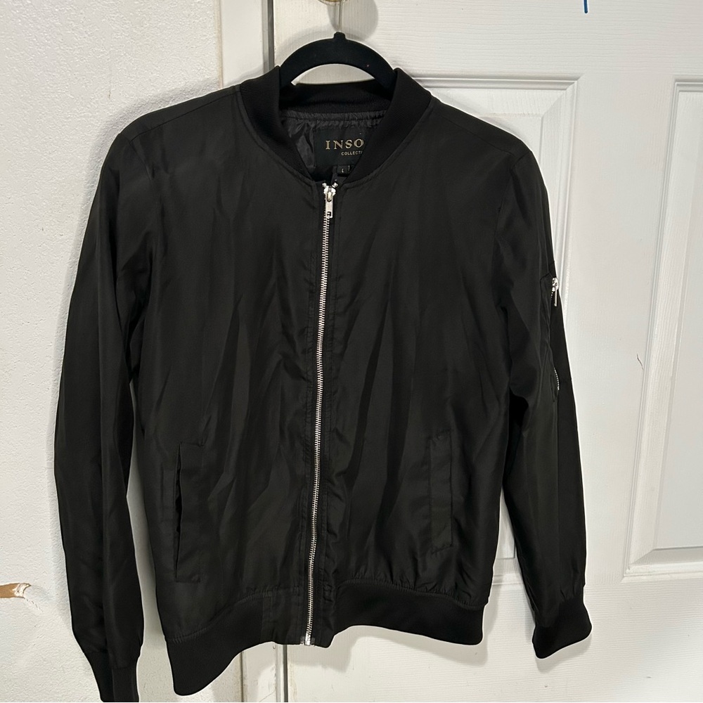 Black zip up sweater.